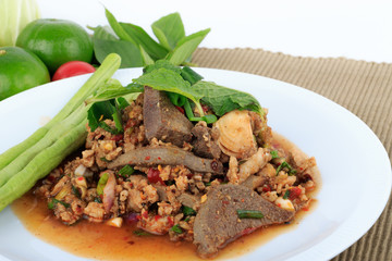 Thai ground pork salad, Spicy minced pork and pork liver salad (Larb Mu) on brown cloth background