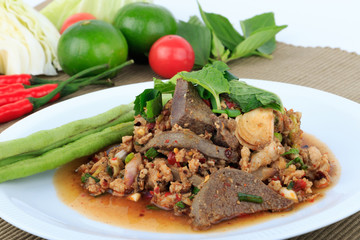 Thai ground pork salad, Spicy minced pork and pork liver salad (Larb Mu) on brown cloth background