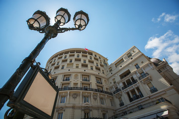 Fototapeta na wymiar Street lamp and luxury building in Monte Carlo, Monaco