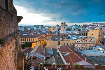 Obraz premium Panoramic view of Cagliari downtown at sunset in Sardinia, Italy