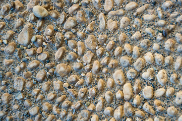 Walkway made of small white stones, typical stone pavement from Liguria