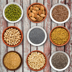 Large seed super food selection in bowls on a wooden background