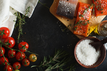 Salmon filets served on wooden kitchen board