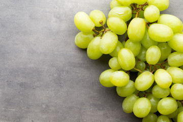 Grape cluster on the grey background.