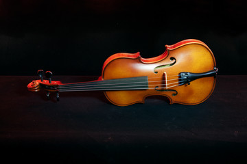 Close up violin isolated in black background