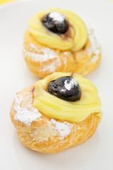 Zeppole - italian pastries on white plate