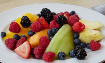 Healthy fruit plate with melons and berries