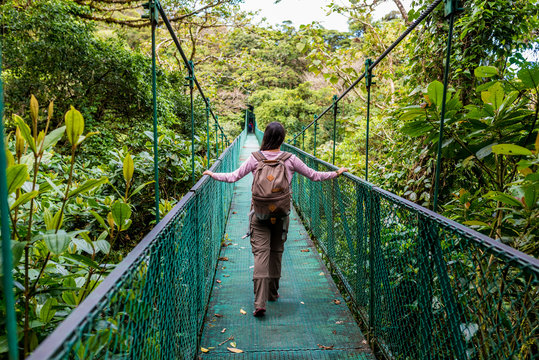 Girl on hanging bridge in cloudforest - Monteverde, Costa Rica