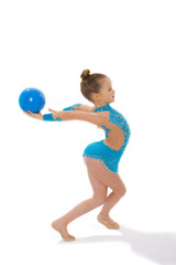 Girl gymnast on a white background with a ball