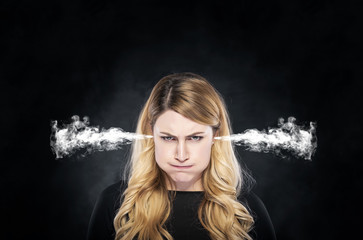 Steam or smoke from the ears of the girl.