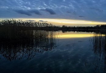 Fototapeta premium After sunset sky reflected in lake water. Beautiful landscape