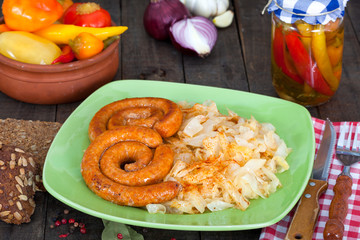Sausages and sauerkraut with brine vegetables salad