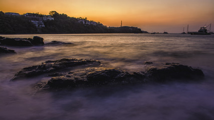 Fototapeta premium Smooth ocean on the rock in the morning