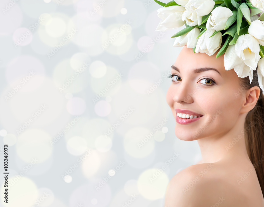 Wall mural portrait of beautiful young woman with flowers in hair