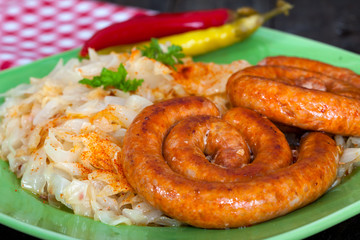 Sausages and sour cabbage with chilli peppers