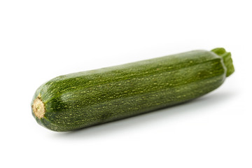 single fresh zucchini on white background