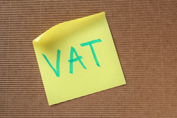 VAT text on yellow sticky note