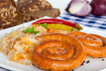 Bavarian fried sausages on sauerkraut