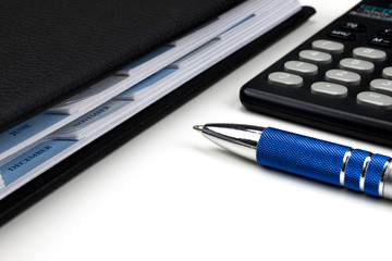 Business and accounting concept
Agenda, pen and calculator on white background.