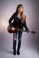 Fototapeta na wymiar Beautiful girl with an electric guitar