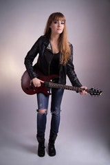 Beautiful girl with an electric guitar