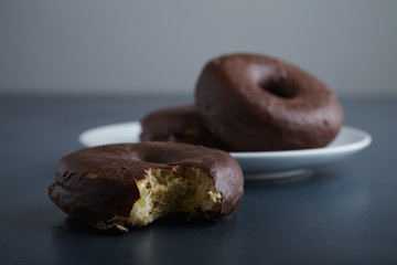 Unfocused choco donuts and focused bite