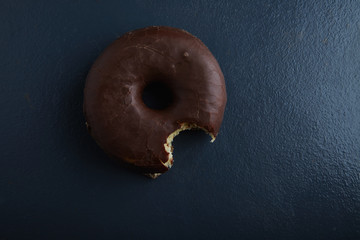 top view bite donut chocolate
