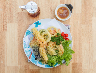 Japanese Food Tempura Mix ingredients are shrimp, carrot, pumpkin, eggplant and onion on wooden table. Top view.