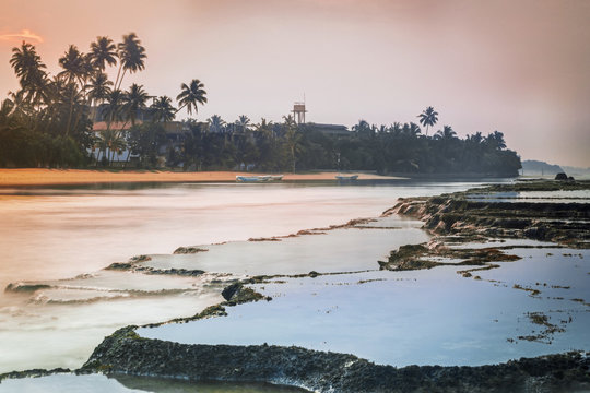 Sri Lanka. Beruwela. Coral reefs near the shore with palm trees 