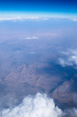 Blue sky background with tiny clouds
