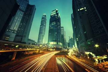 Fotobehang traffic in Hong Kong at sunset time © Iakov Kalinin