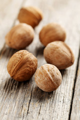 Walnuts on a grey wooden table