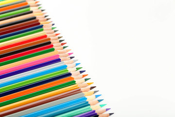 Drawing colourful pencils on a white background, close up