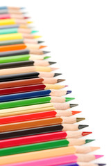 Drawing colourful pencils on a white background, close up