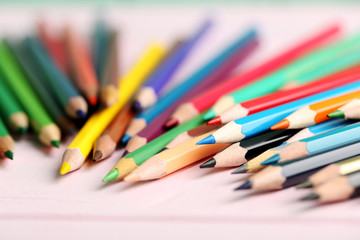 Fototapeta premium Drawing colourful pencils on a wooden background