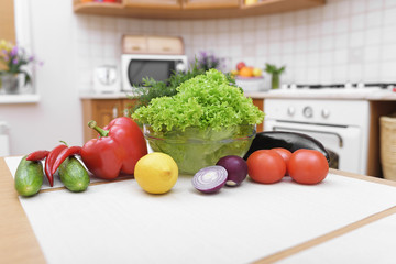 Fresh vegetables on kitchen table.