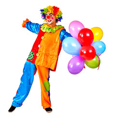 Happy birthday clown holding keeps bunch of balloons.  Isolated.