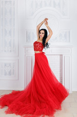 Beautiful girl in long red dress