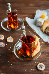 Turkish sweets and tea on a dark background
