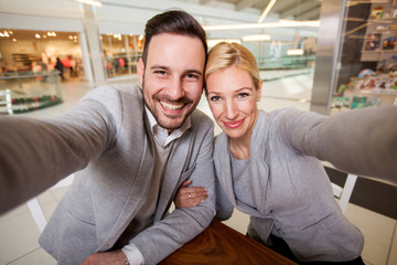 Happy young couple taking selfi