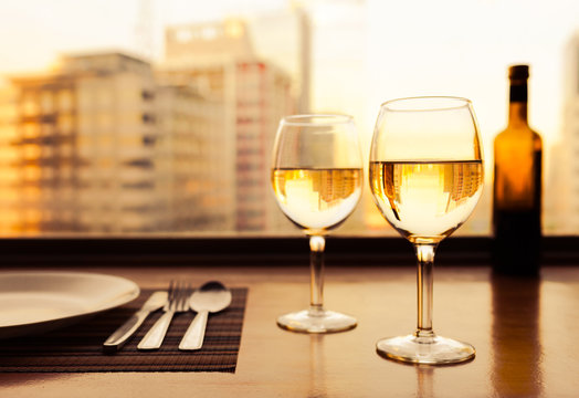 Wine glasses in a restaurant setting,