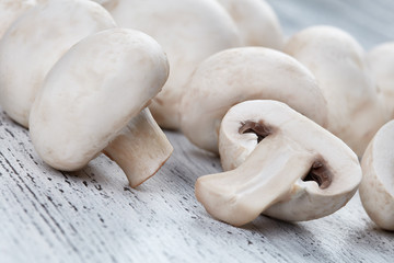 Champignon on wooden background