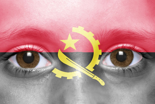 human's face with angolan flag