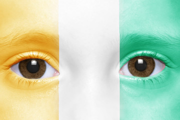 human's face with ivorian flag