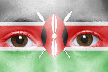 human's face with kenyan flag