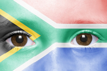 human's face with south africa flag