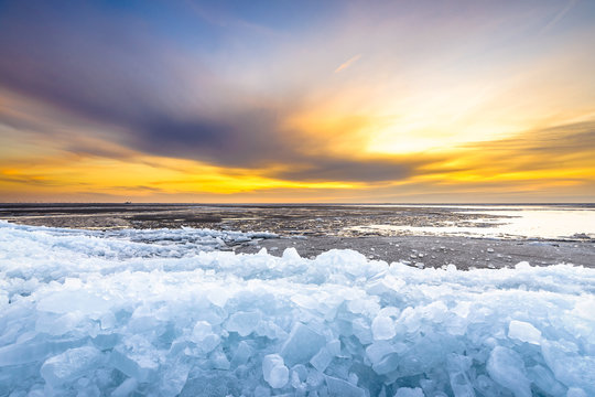 Pieces of drifting ice at sunset, IJsselmeer, Netherlands