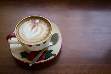 Hot art Latte Coffee in the table