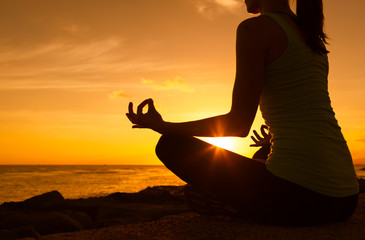 Peaceful yoga in a beautiful sunset. 