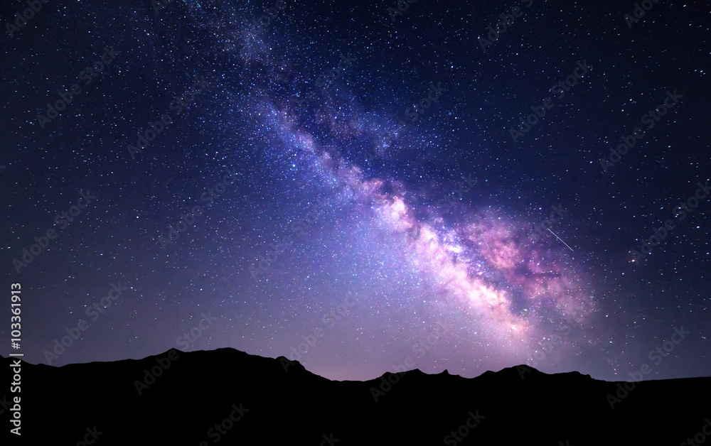 Wall mural landscape with milky way. night sky with stars at mountains